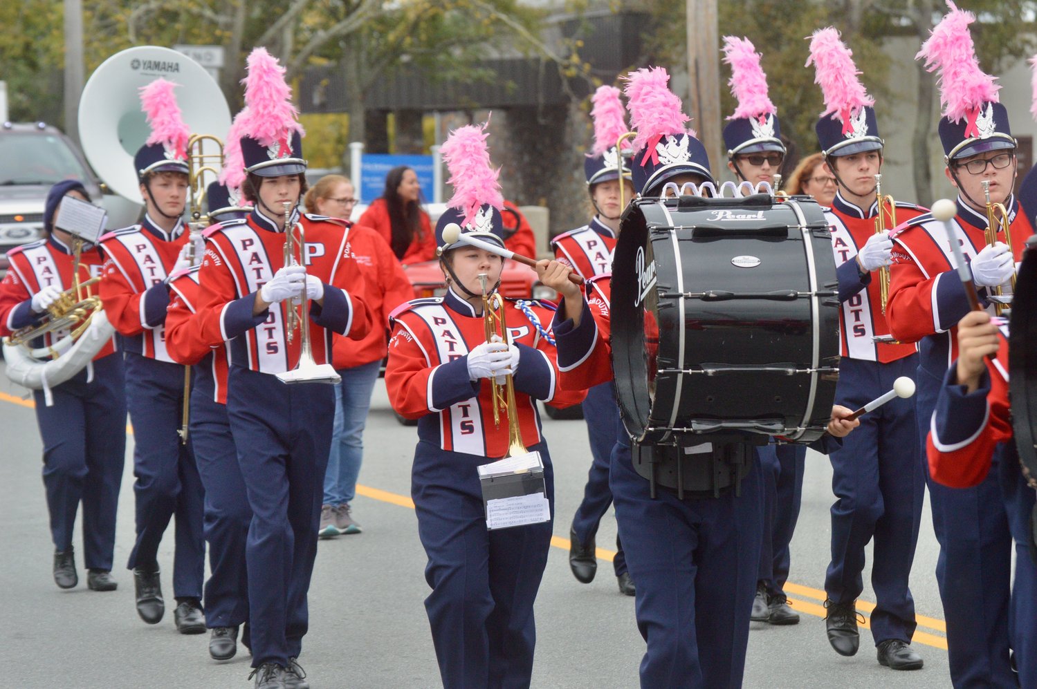 Members of the Portsmouth High School Marching Band head down East Main Road.