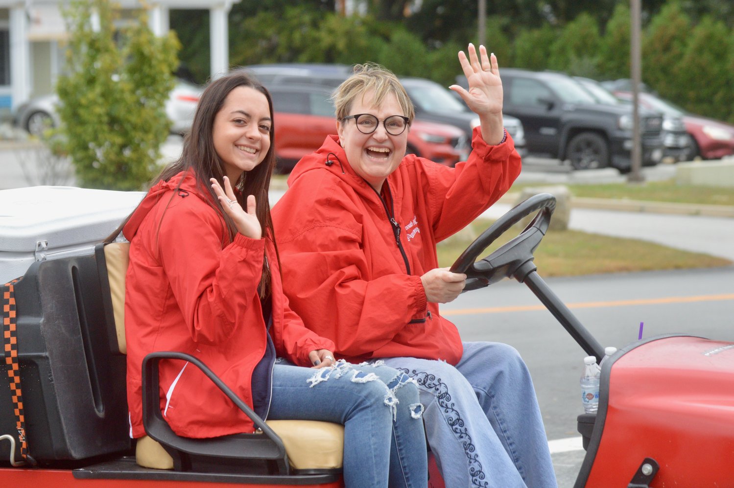 Sheli Beck Silveria (right) rides in the parade alongside Melina Johnson, a 2019 graduate of Portsmouth High School.