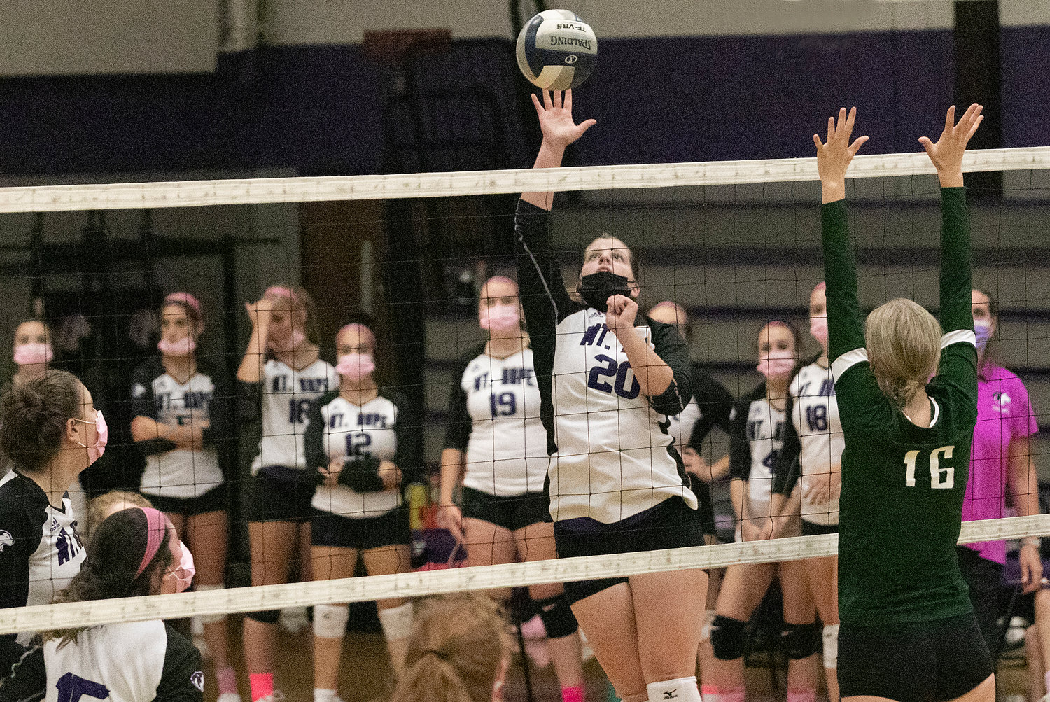 Senior Grace Stephenson slams an Abby Malafronte pass over the net for a Huskies point during a home game against Chariho on Tuesday. 