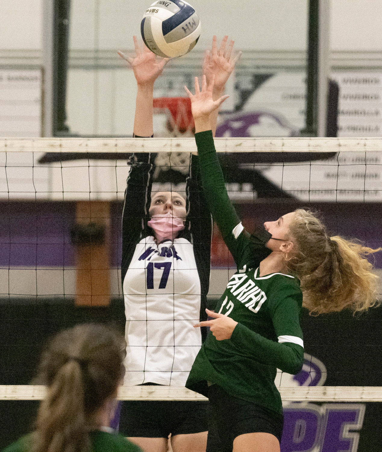 Freshman middle hitter Abby Allen makes a block during a home game against Chariho on Tuesday. 