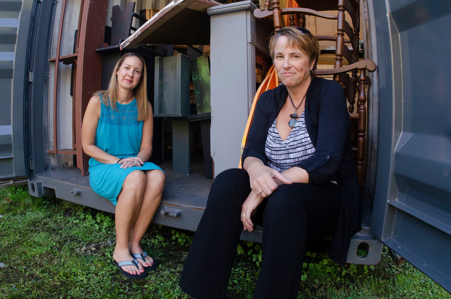 Bristol Theatre Company Vice Chairman Tracy Lima and Chairman Marie Knapman at the storage container that contains much of the physical infrastructure of their one-thriving community theater.
