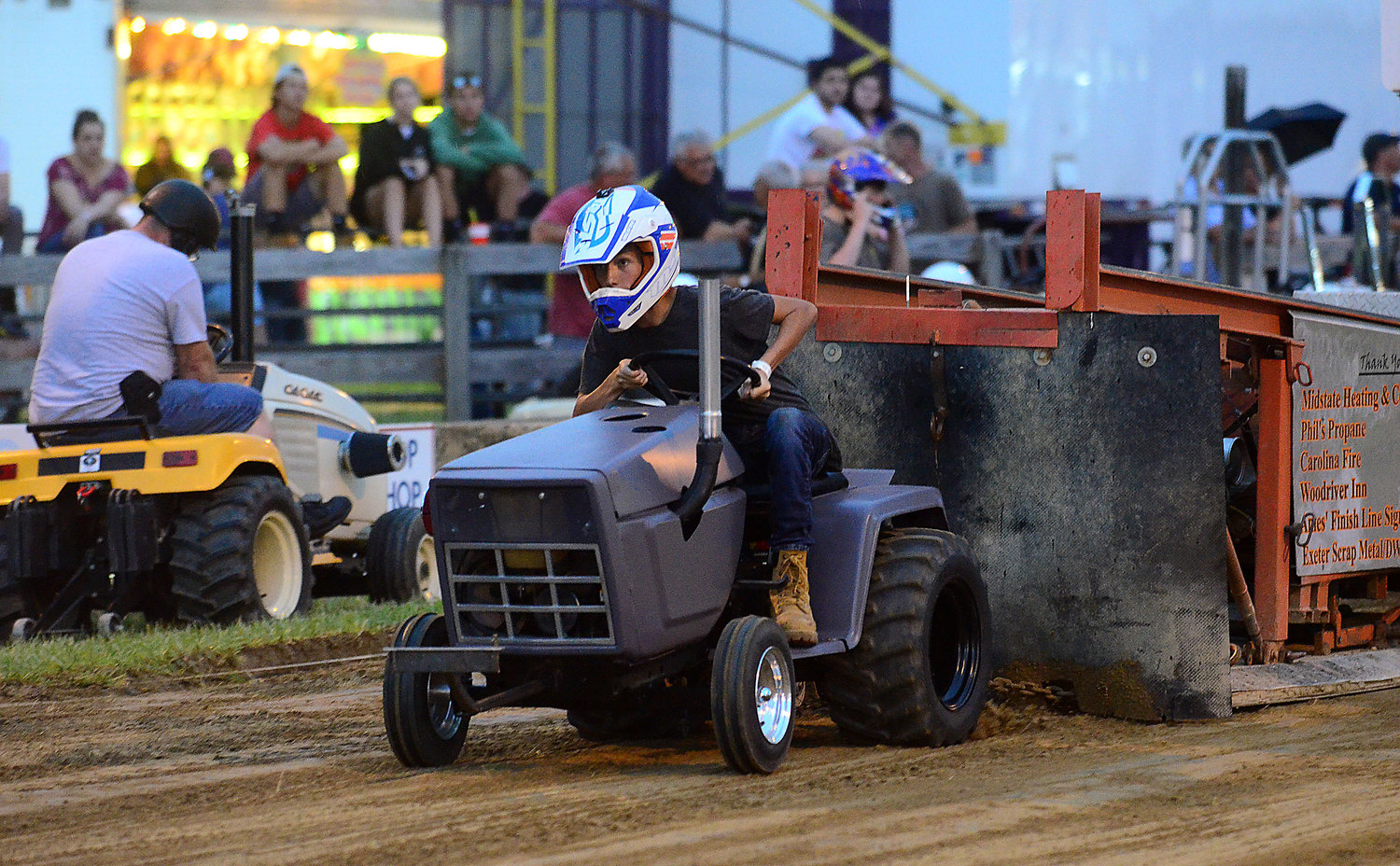 Liam Sylvia, 14, of Westport, revs up his tractor during the D Stock Division tractor pull at the Westport Fair in 2019.