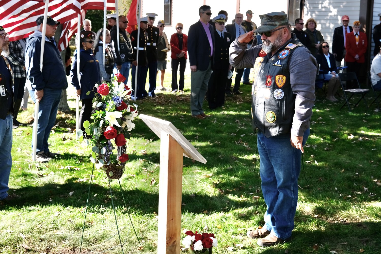 Russ Shipp salutes the memory of his brother, Corp. Thomas A. Shipp, after placing a rose to a wreath outside the Portsmouth Historical Society during the annual Beirut Memorial Service on Saturday. Corp. Shipp was among the nine Rhode Islanders killed in the Beirut terrorist bombing attack on Oct. 23, 1983.