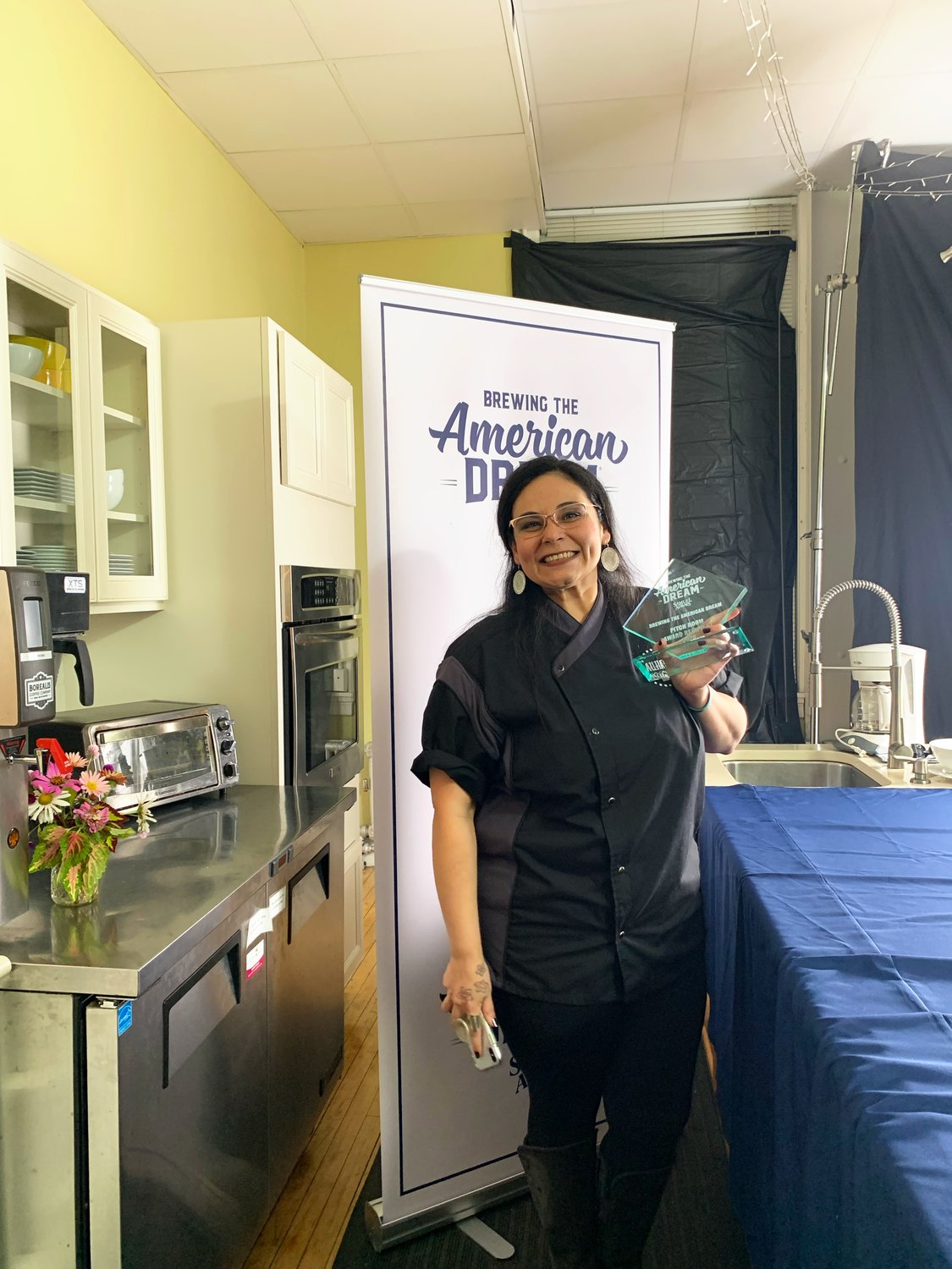 Aura Fajardo, owner of Aura's Chocolate Bar, won the $8,000 grand prize at the first Pitch Room Competition, sponsored by Sam Adams Brewing Company.