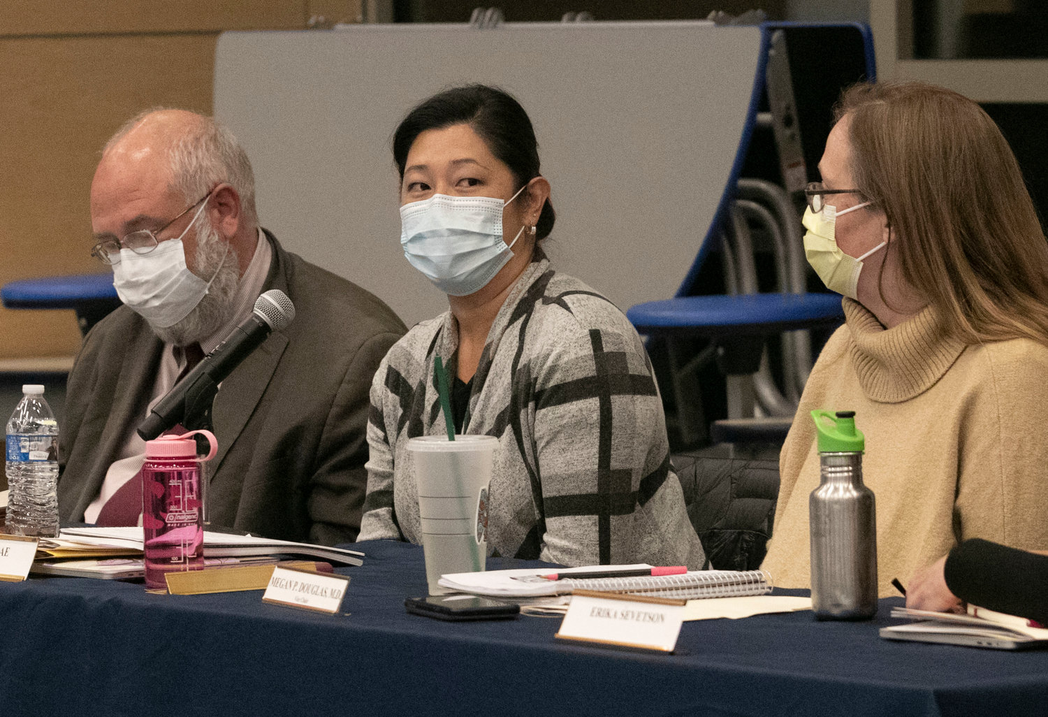 School committee chairwoman Gina Bae (center) speaks during Thursday night's pre-termination hearing. The committee voted 3-1 to fire three unvaccinated teachers.