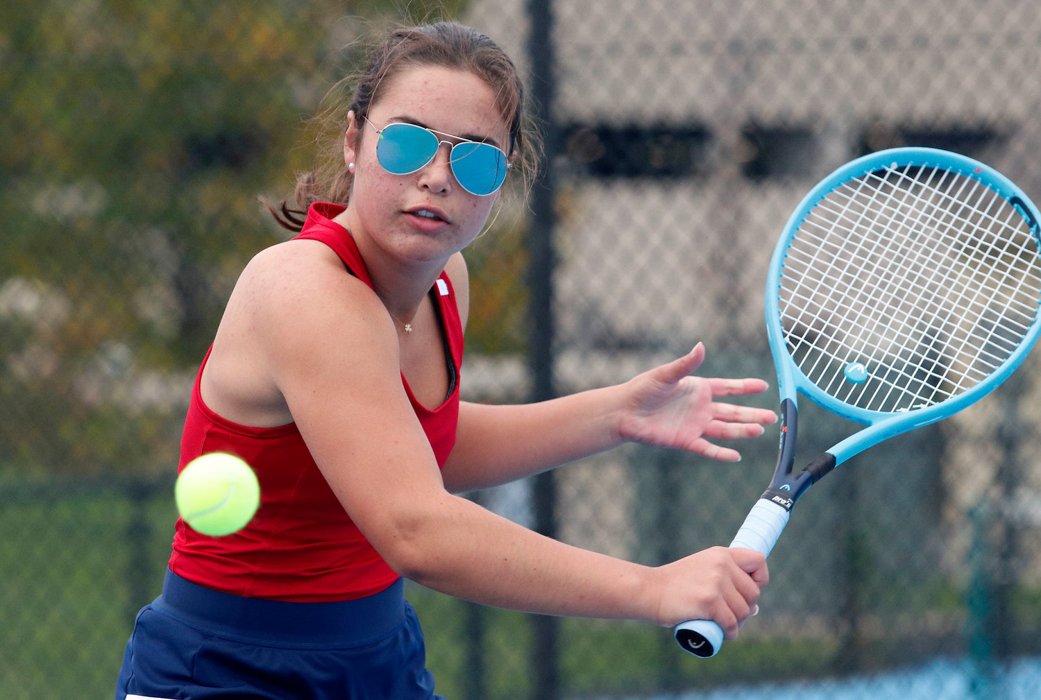 Portsmouth High’s Talus Nightingale strokes a backhand during her No. 1 singles match against Elsa White of Mt. Hope. Nightingale won, 6-4, 6-4.