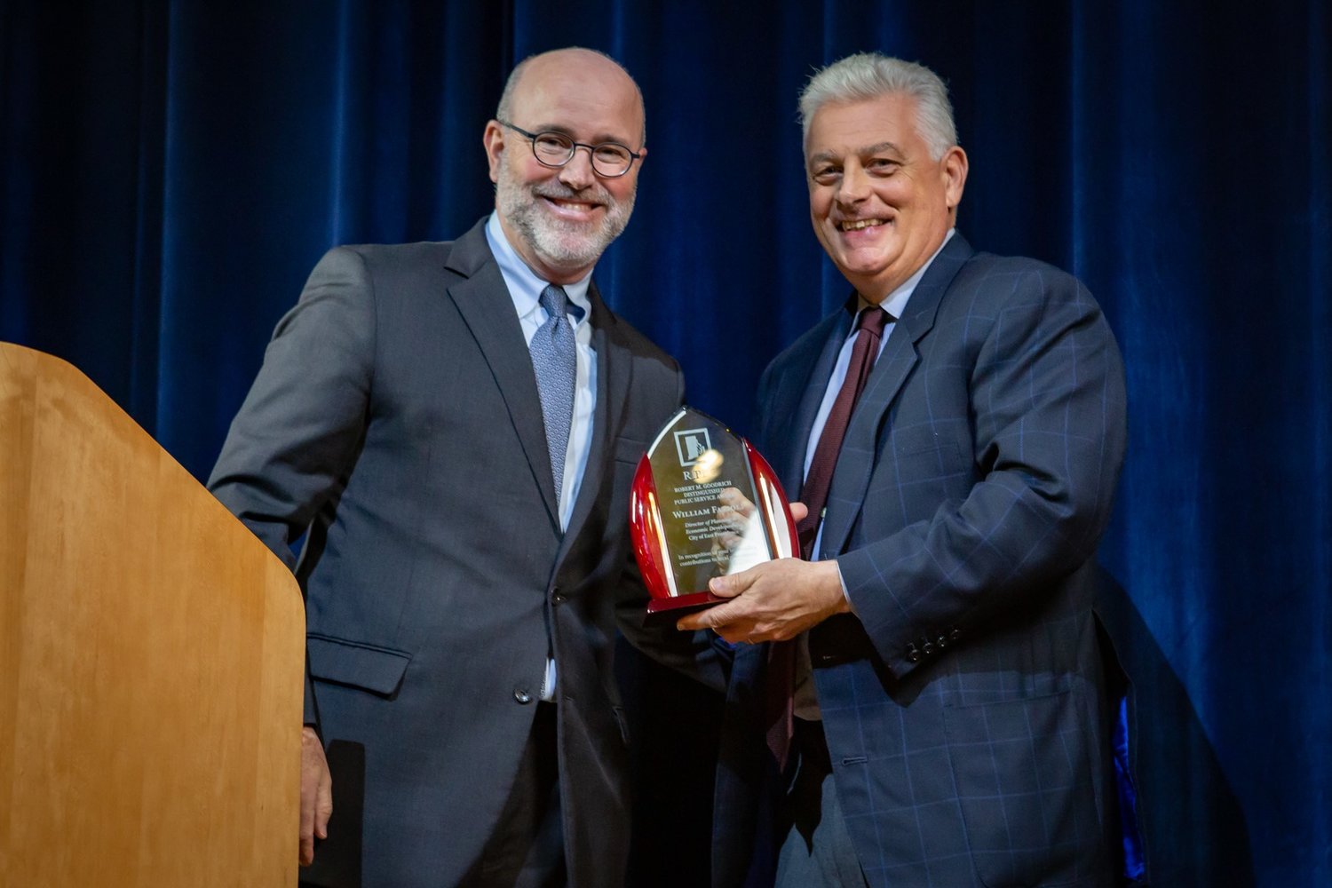 RIPEC board vice chairman Patrick Rogers (left), a partner in the law firm Hinckly Allen & Snyder LLP and former East Providence City Councilor, presents Bill Fazioli with the body’s Robert M. Goodrich Distinguished Public Service Award.