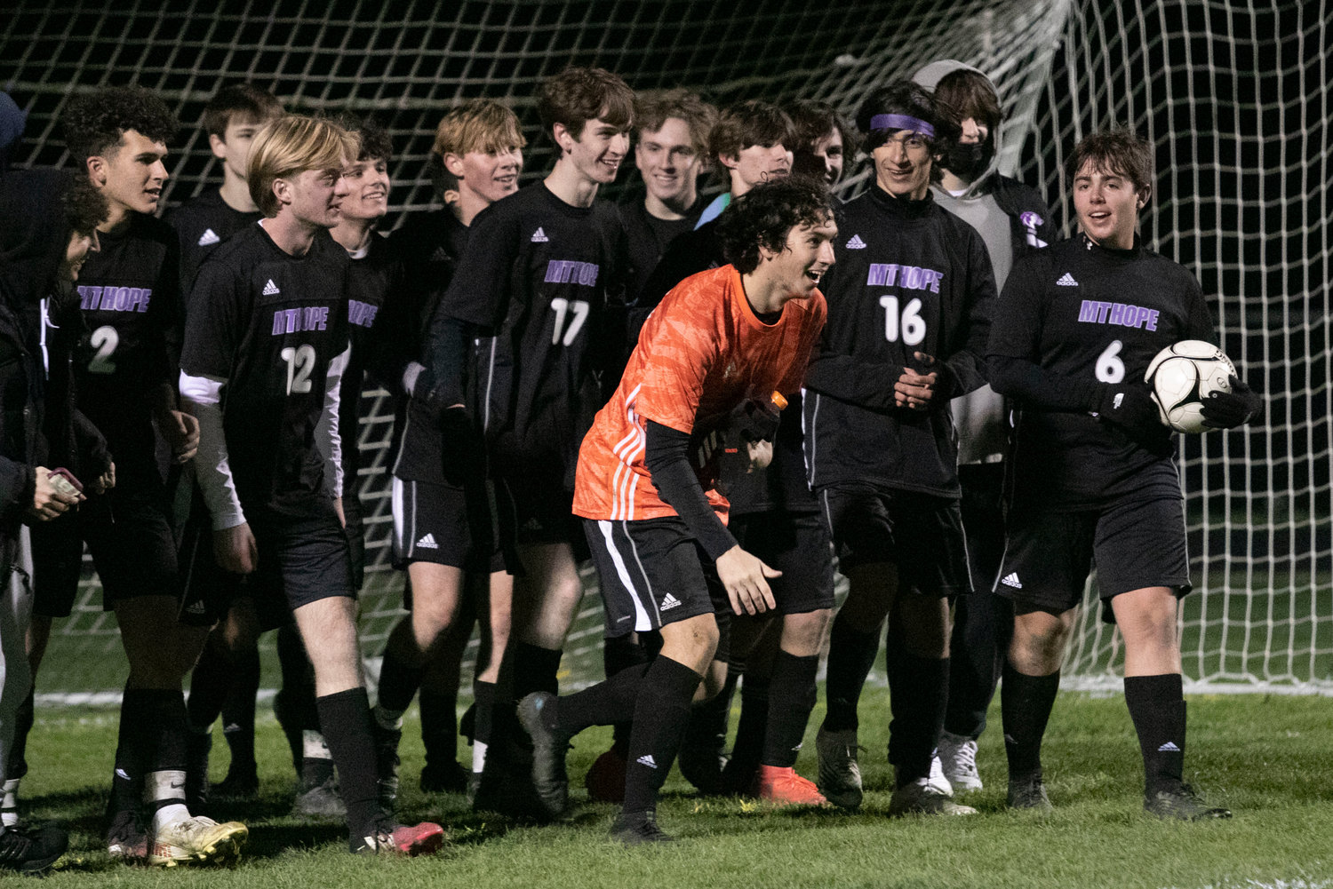 Goalkeeper Matt Terceiro (middle) and teammates celebrate after the game.