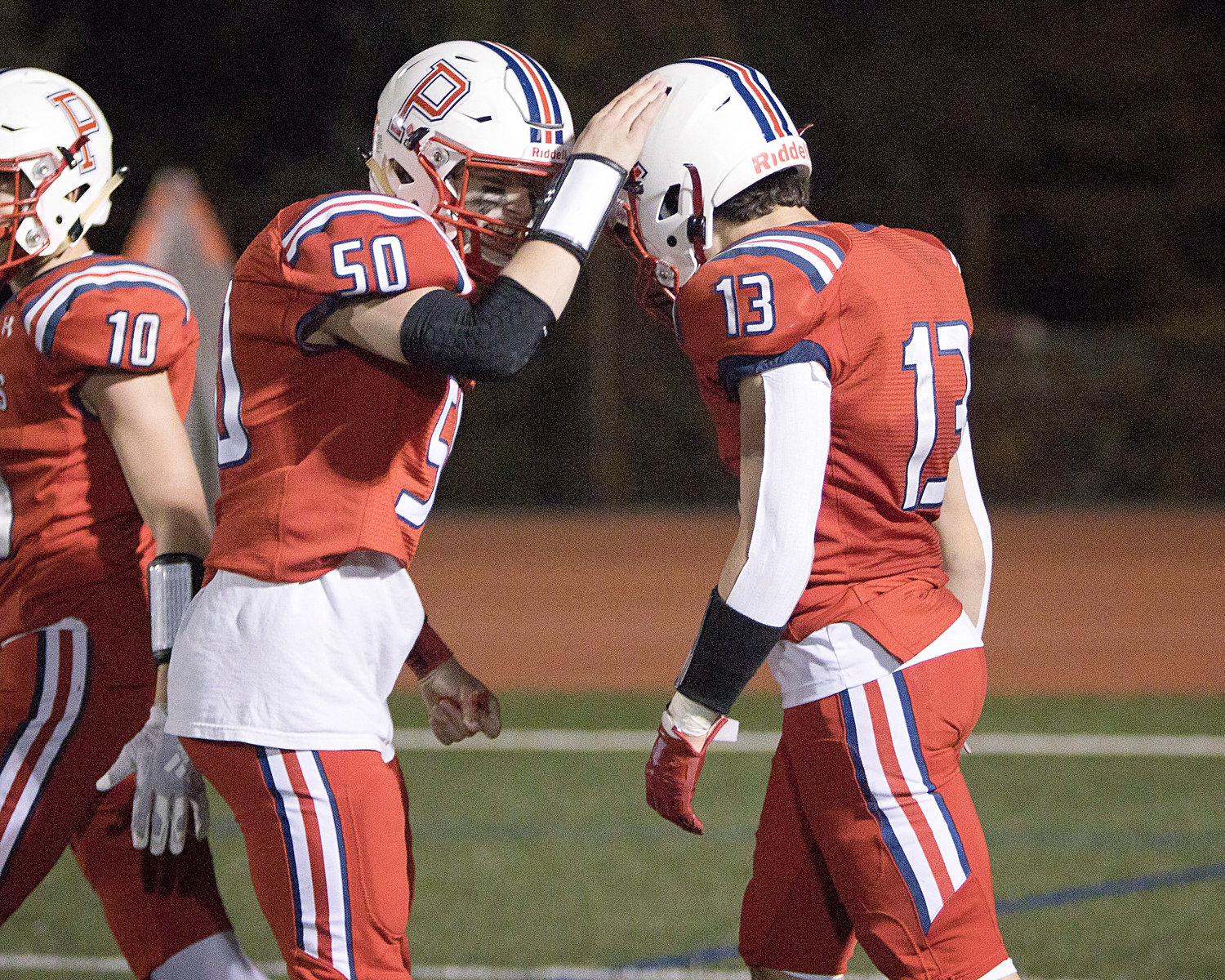 Evan Beese (right) is congratulated by Henry Rodrigues after picking off a pass on Shea’s opening possession.