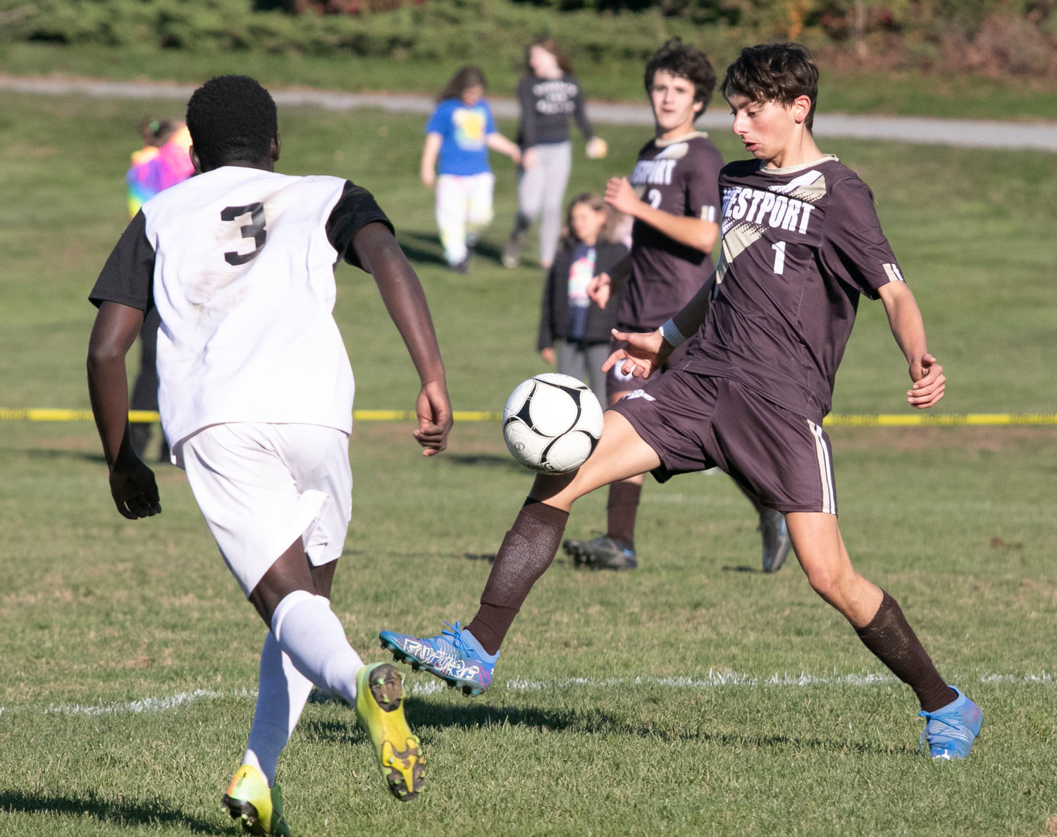 Midfielder Owen Couto collects a pass from a teammate at midfield.