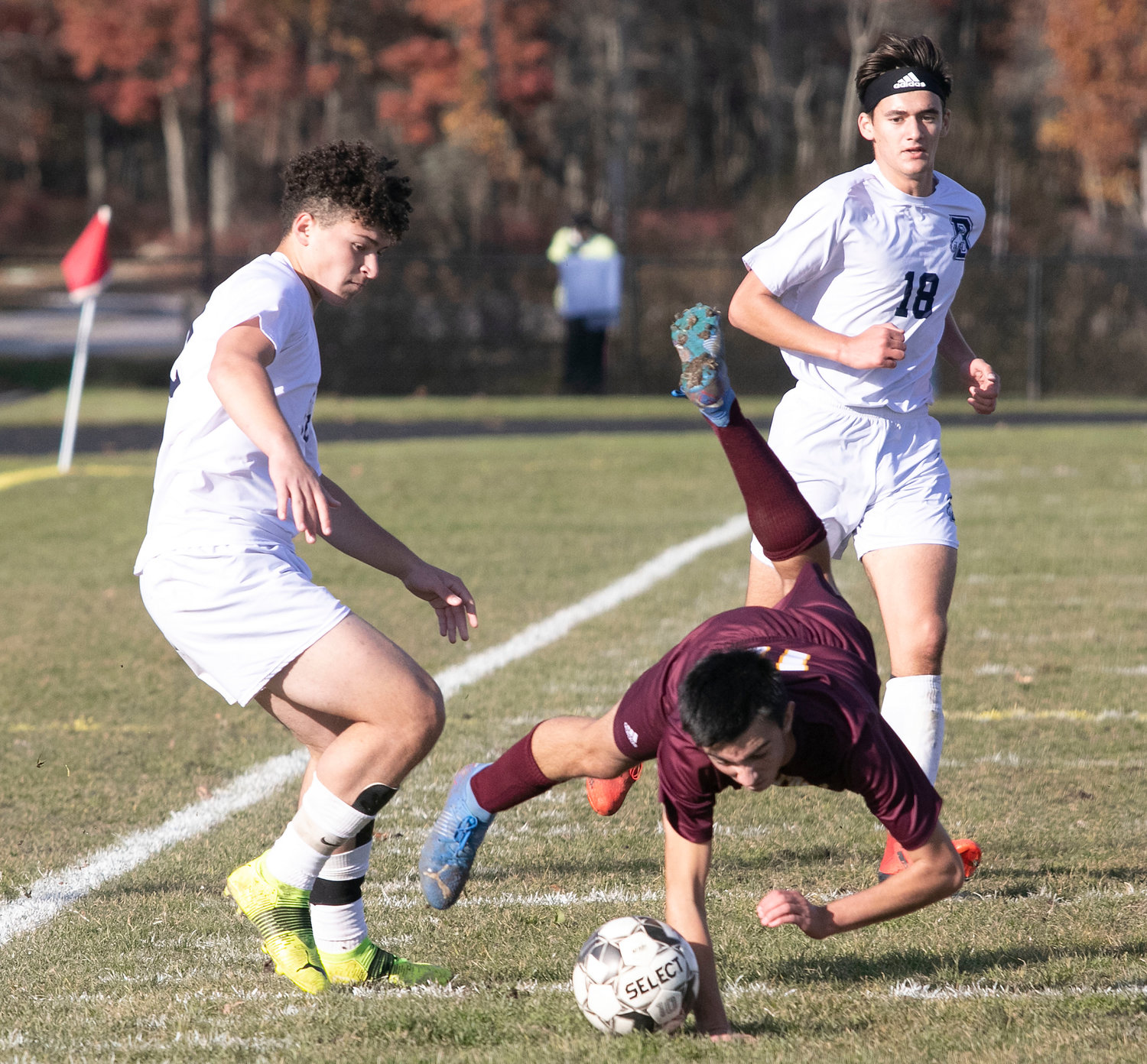 Midfielder Connor Nobrega is upended while dribbling up field in the second half.