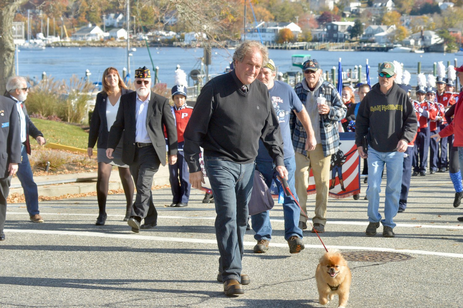 Veteran John Vitkevich — and his four-legged pal, Nicholas — lead the parade from Stone Bridge to Thriving Tree Coffee House on Park Avenue.