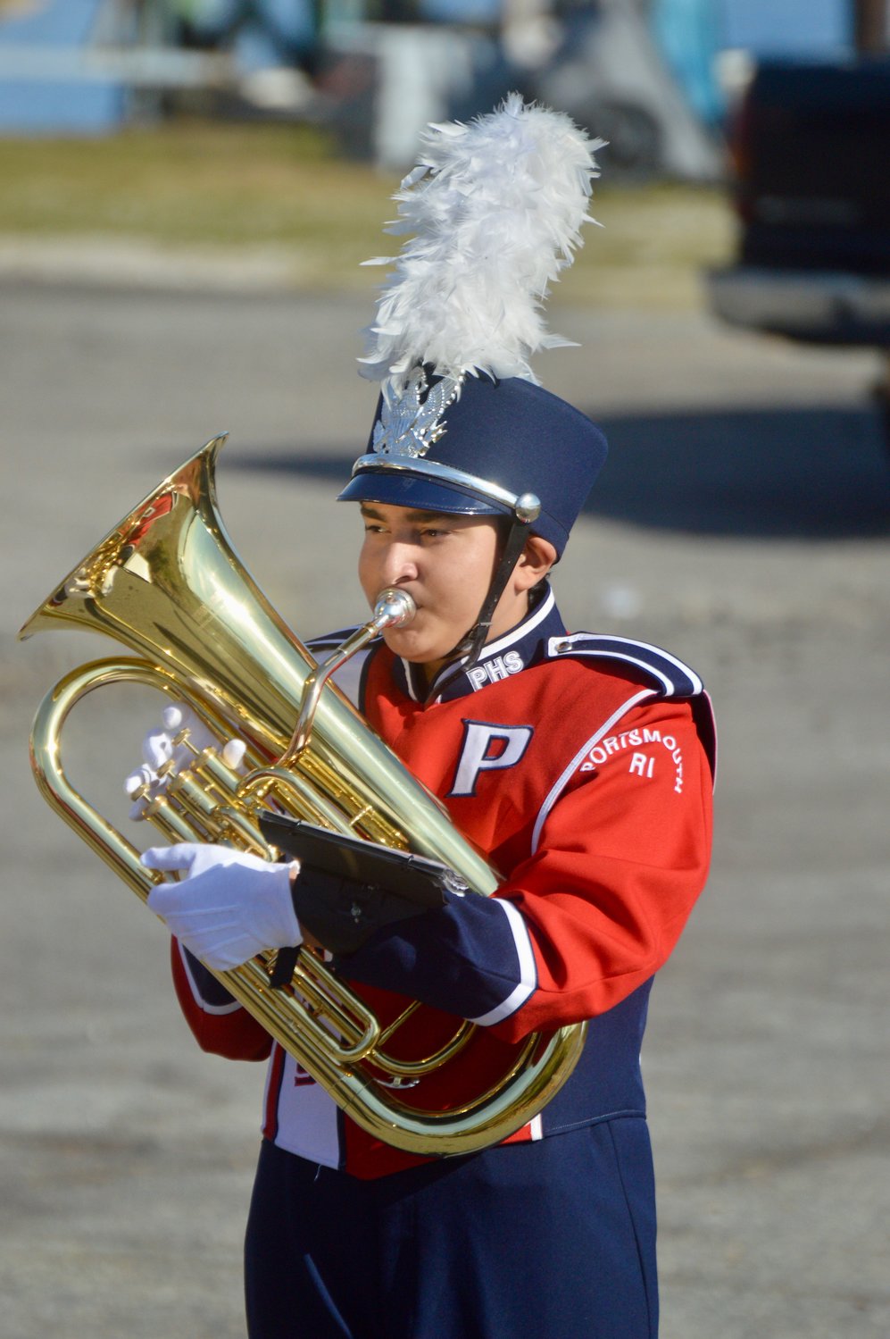 A member of the PHS Marching Band warms up near Stone Bridge before the short Veterans Day parade.