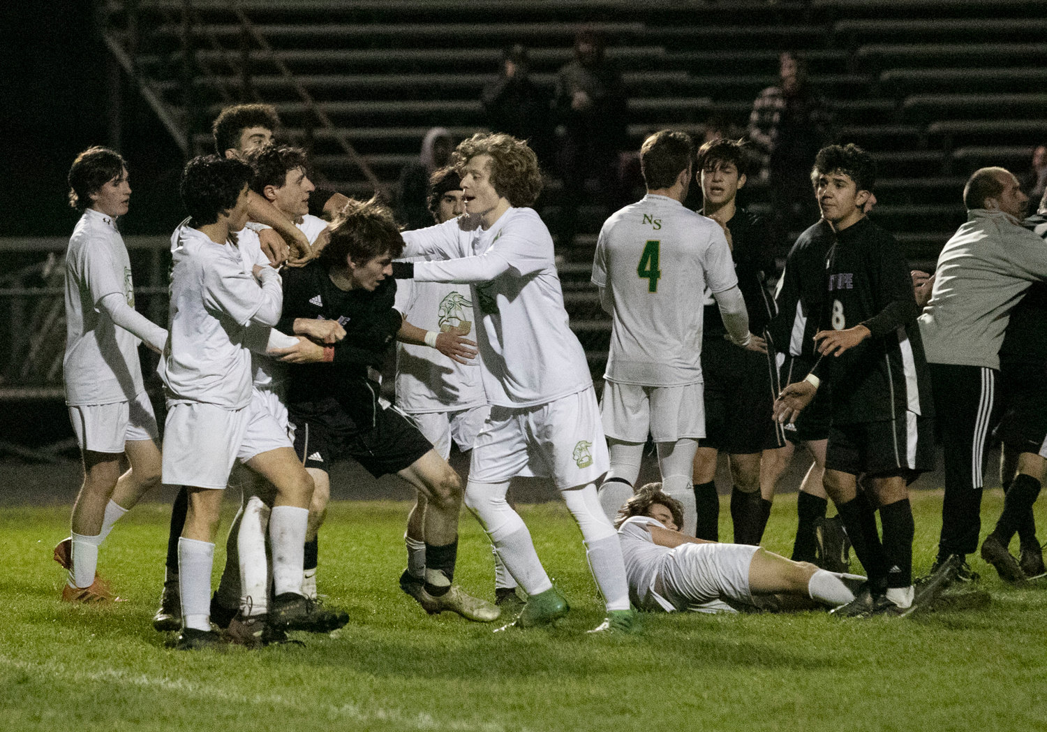 A group of Northmen contain Huskies senior Dylan Brol during a melee late in the game. Brol was tripped in the box and fell flat on his face. The defender also fell and rolled over the top of the senior. Infuriated, Brol came up swinging and a melee ensued.