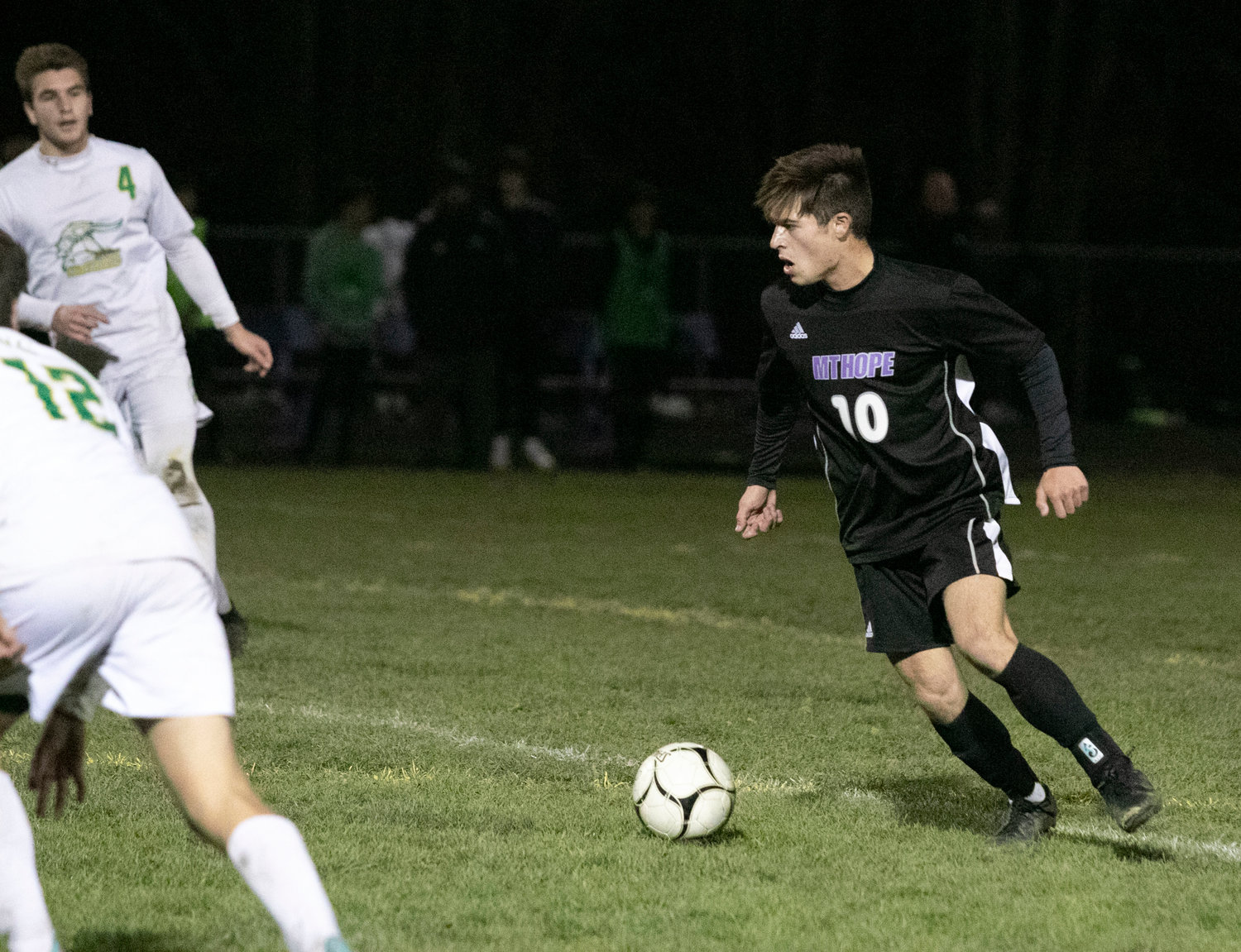 Huskies midfielder Nick Andreozzi dribbles the ball up field in the first half. The Huskies co-captain re-injured his leg in the second half, a big blow for the Huskies who could have used his leadership on the field, down the stretch.