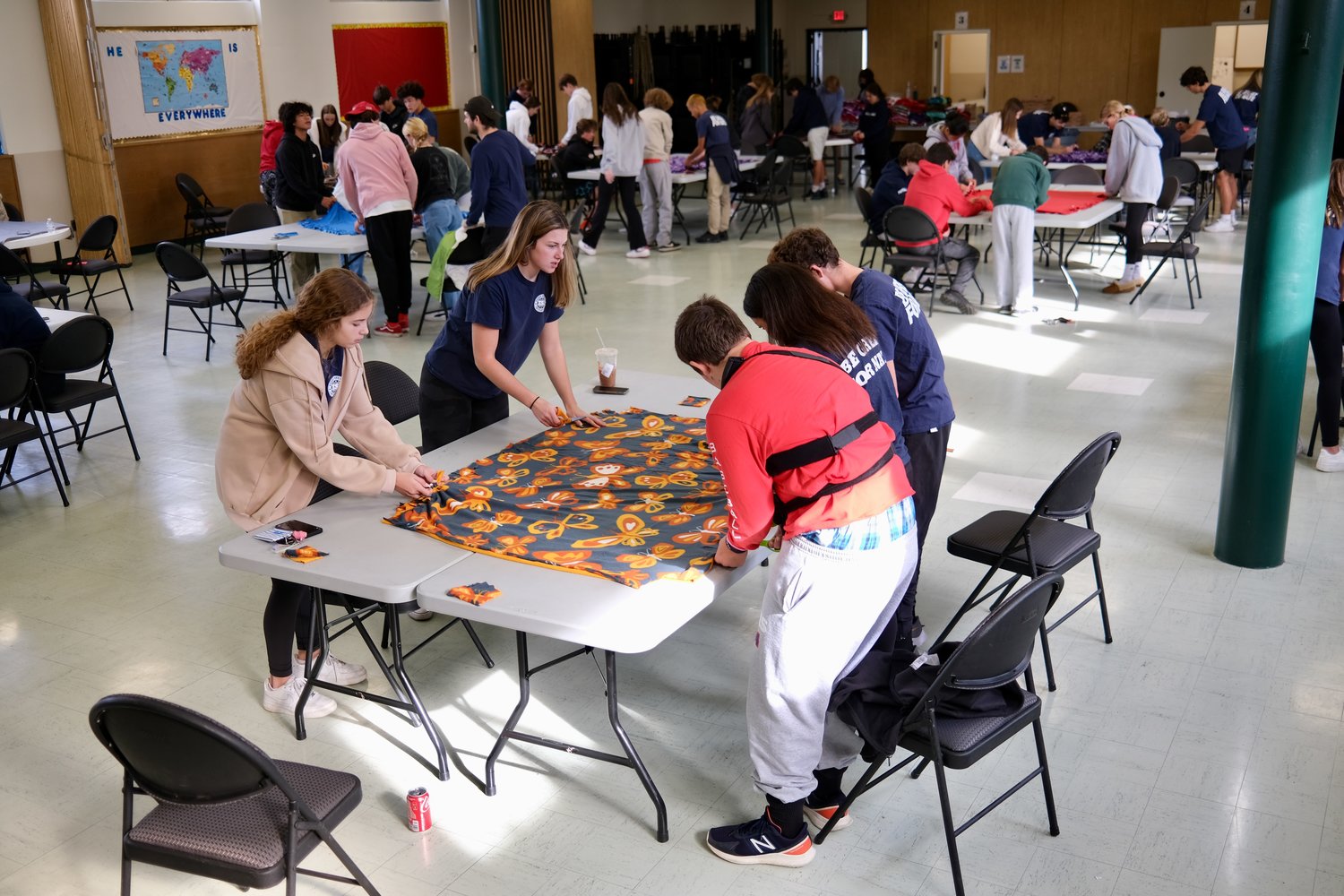 About 80 Every Student Initiative members turned out to St. Barnabas Church on Sunday to make blankets for children with cancer.