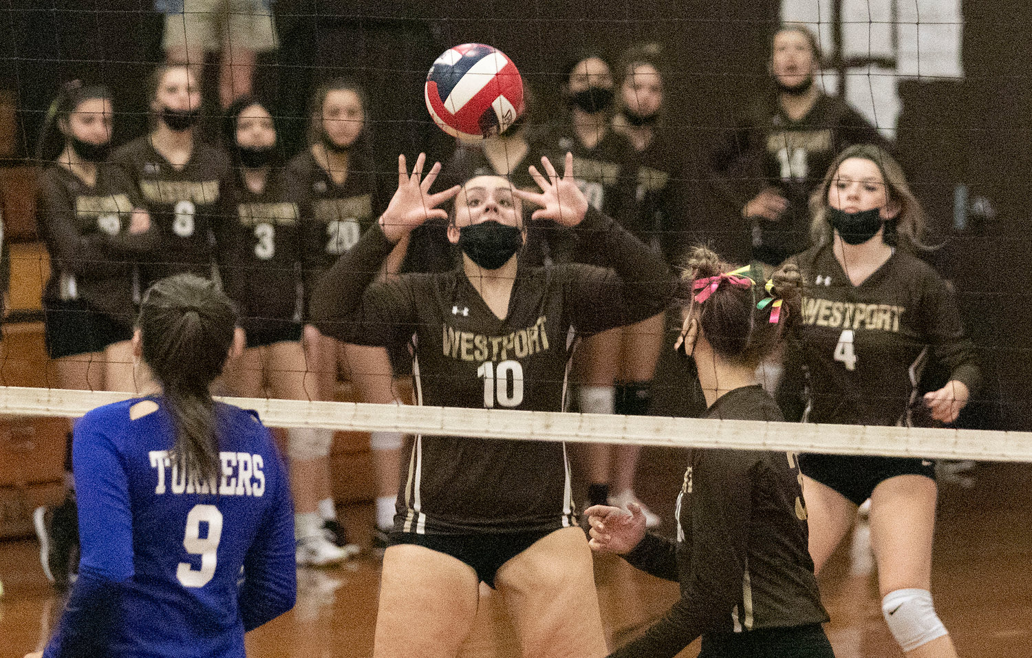 Senior setter Abby Gaudreau sets the ball during a Wildcats rally. Gaudreau tallied five kills and eighteen assists during the loss.
