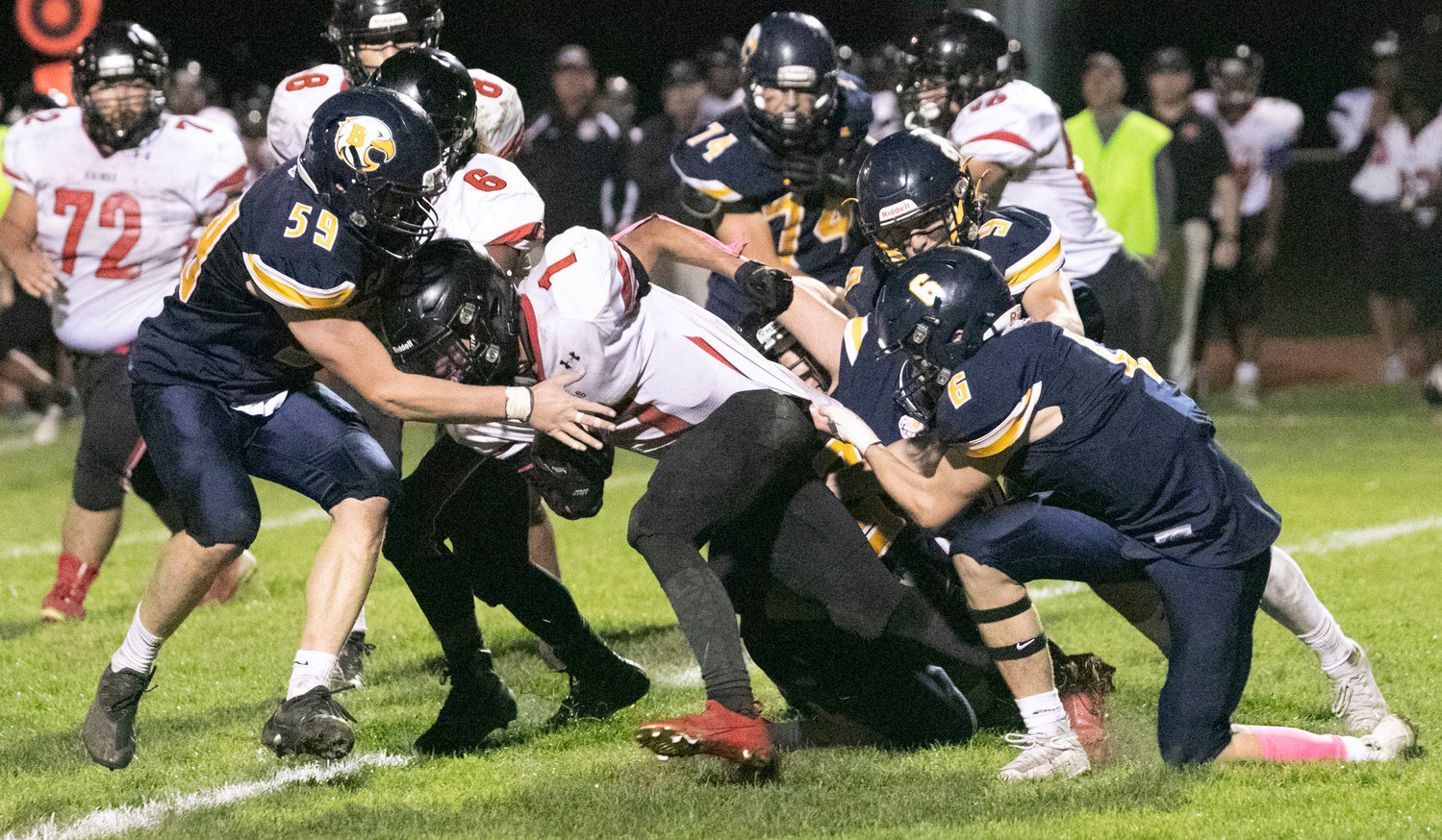 A gang of BHS defenders bring down an opposing running back during an earlier game this season.