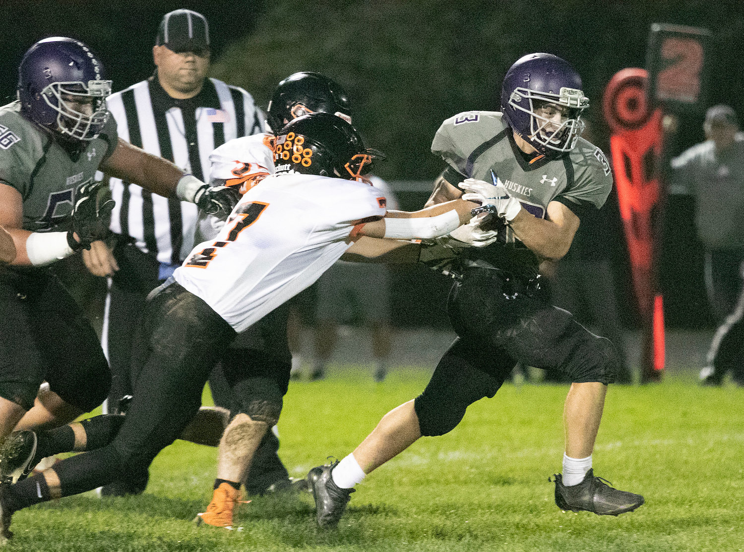 Mt. Hope’s Brock Pacheco breaks away from a would-be tackler during a Huskies’ game this season.