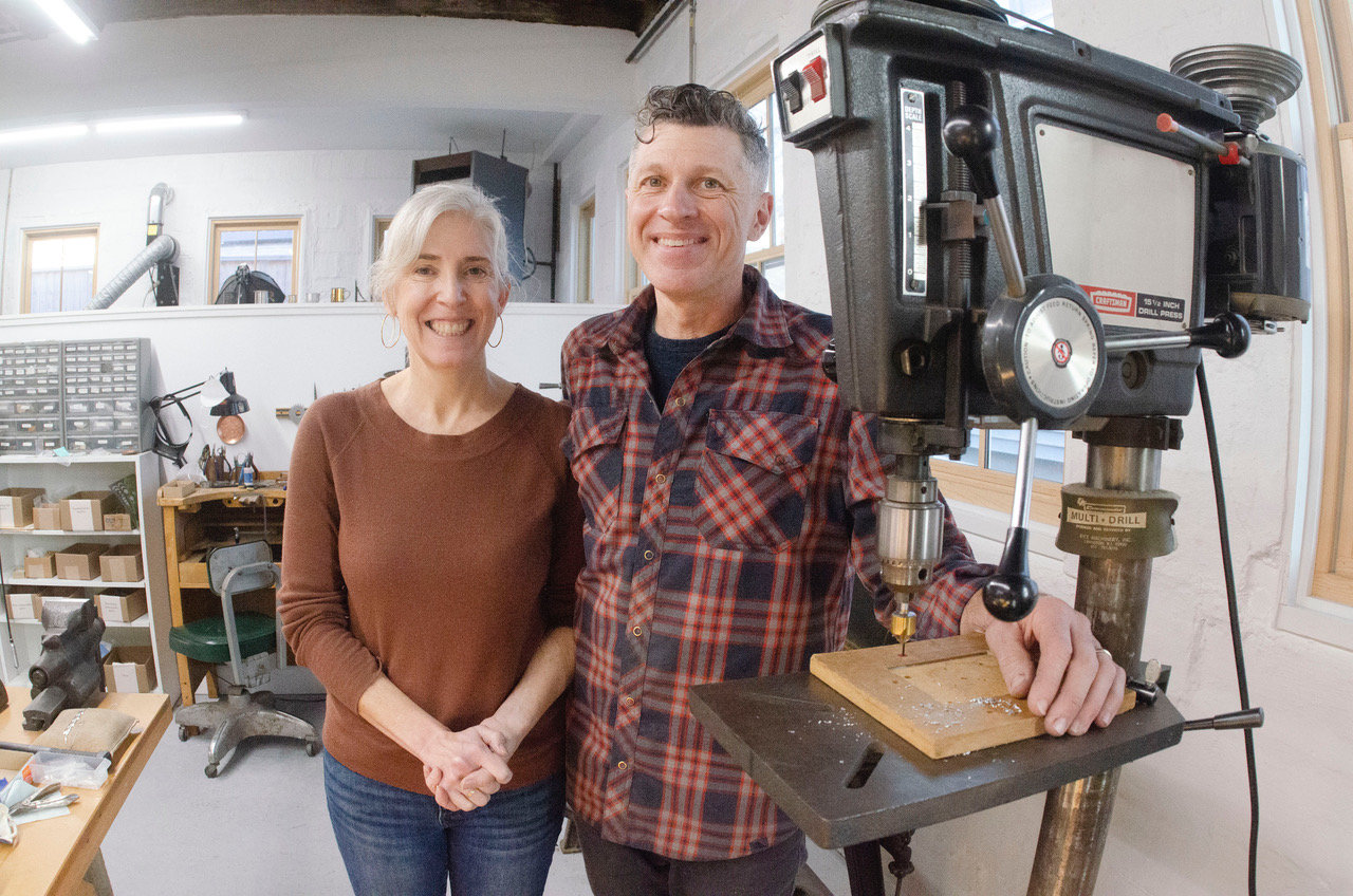 Sandi Bozanelli and Jim Dowd in Beehive Handmade's new production facility on Water Street. The artists have been creating functional metal crafts locally for more than two decades, earning national recognition in the process.