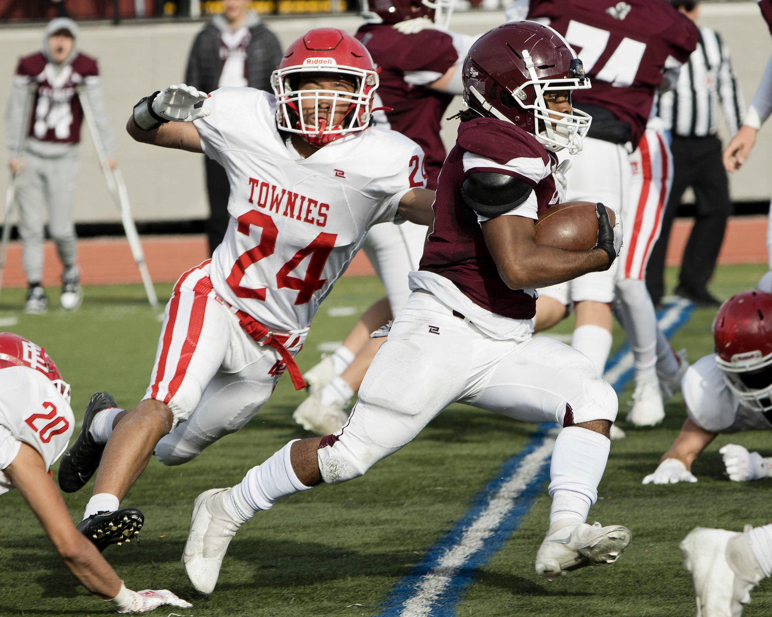 East Providence’s Marcus Garedo reaches for the LaSalle running back during the annual Thanksgiving game.