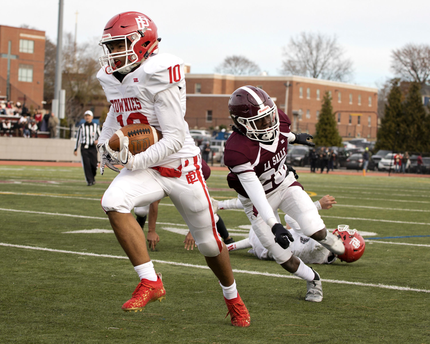 East Providence’s Xavier Hazard finds a gap and races toward the LaSalle goal line, gaining significant yardage for the Townies during the second half of the teams' 2021 Thanksgiving game played November 25 in Providence.