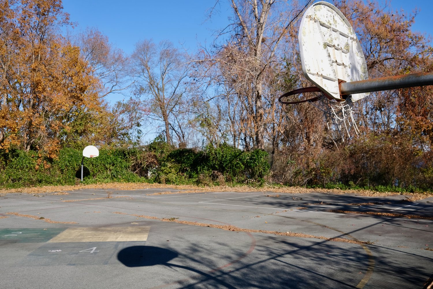 These abandoned basketball courts at Elmhurst Park will be developed into four new pickleball courts if the Town of Portsmouth wins a matching state recreation development grant.