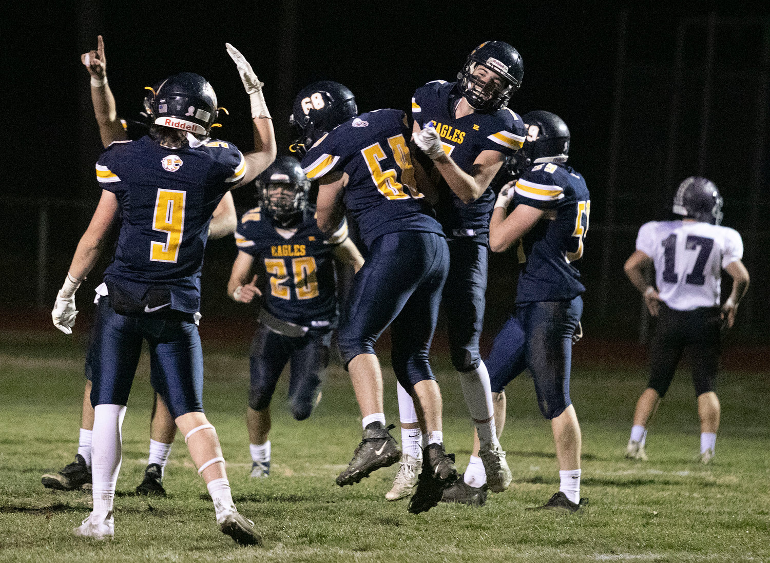 The Eagles celebrate after Bryan Ivatts scores on a long touchdown run in the first half.