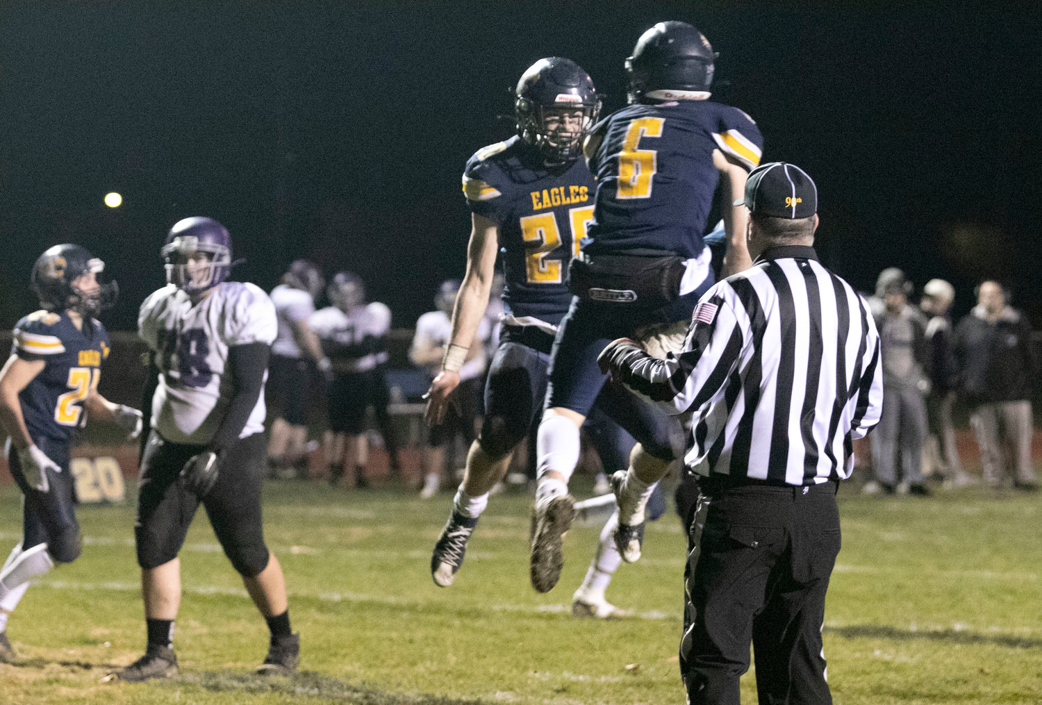 Bryan Ivatts (left) celebrates with a teammate after scoring a touch down in the first half.