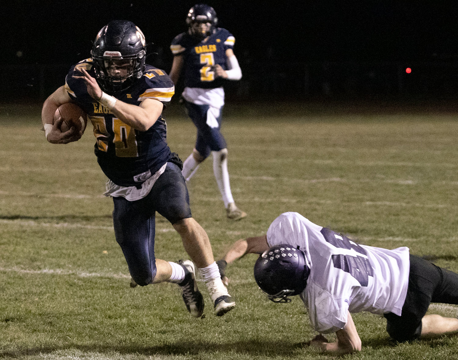 Senior running back Bryan Ivatts breaks a tackle for a long gain in the first half.