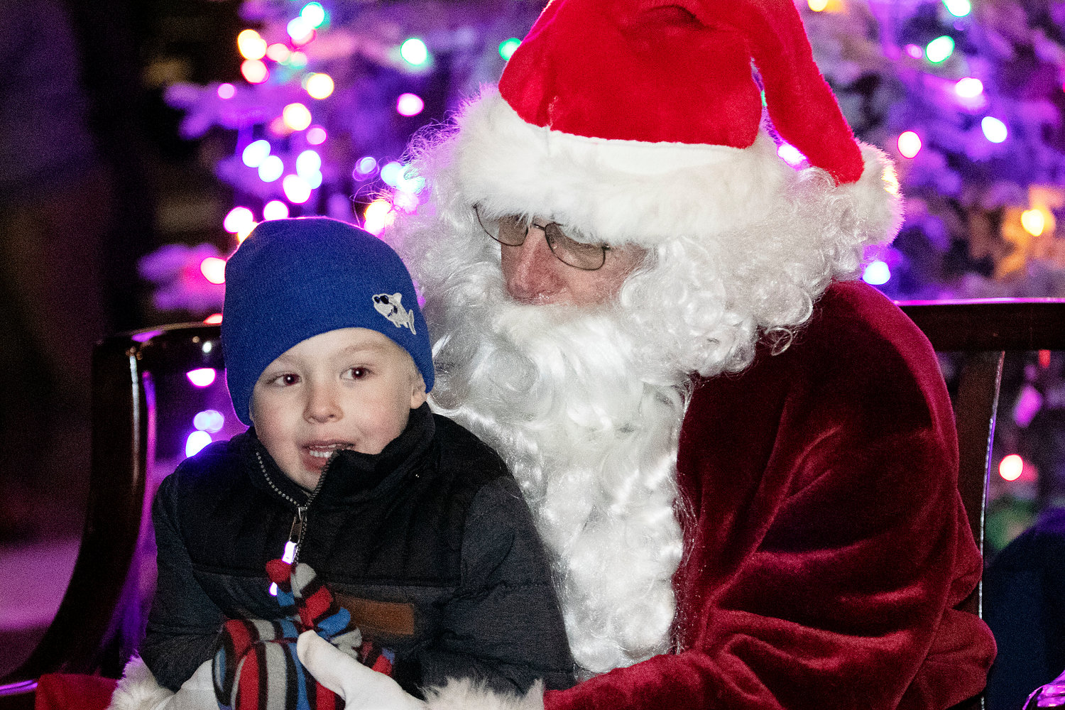Henry Doppke tells Santa what he would like for Christmas at the 2021 East Providence City Hall Tree Lighting ceremony.