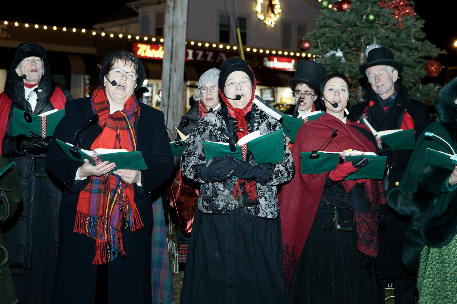 Members of "Voices of Christmas" entertain guests with Christmas carols while waiting for Santa to arrive at the Riverside Renaissance Movement Tree Lighting, Friday, Dec. 3.