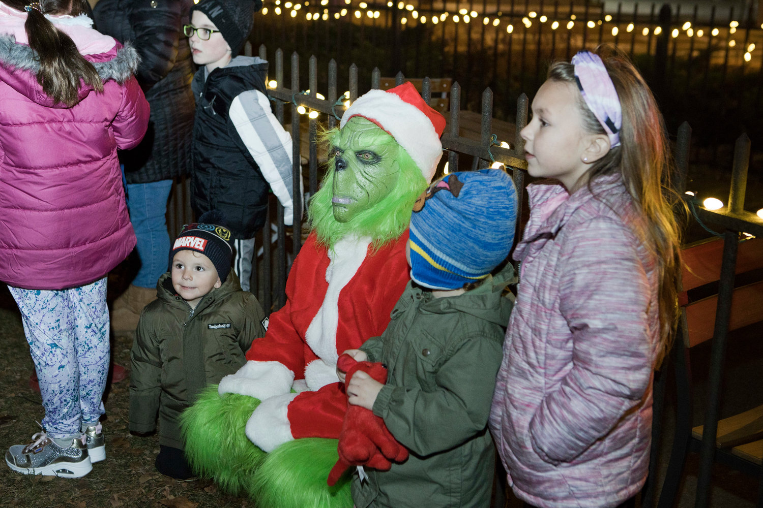 Dennis Carrier makes friends with the crowd while dressed as the “Grinch” at the Riverside Renaissance Movement Tree Lighting, Friday, Dec. 3.