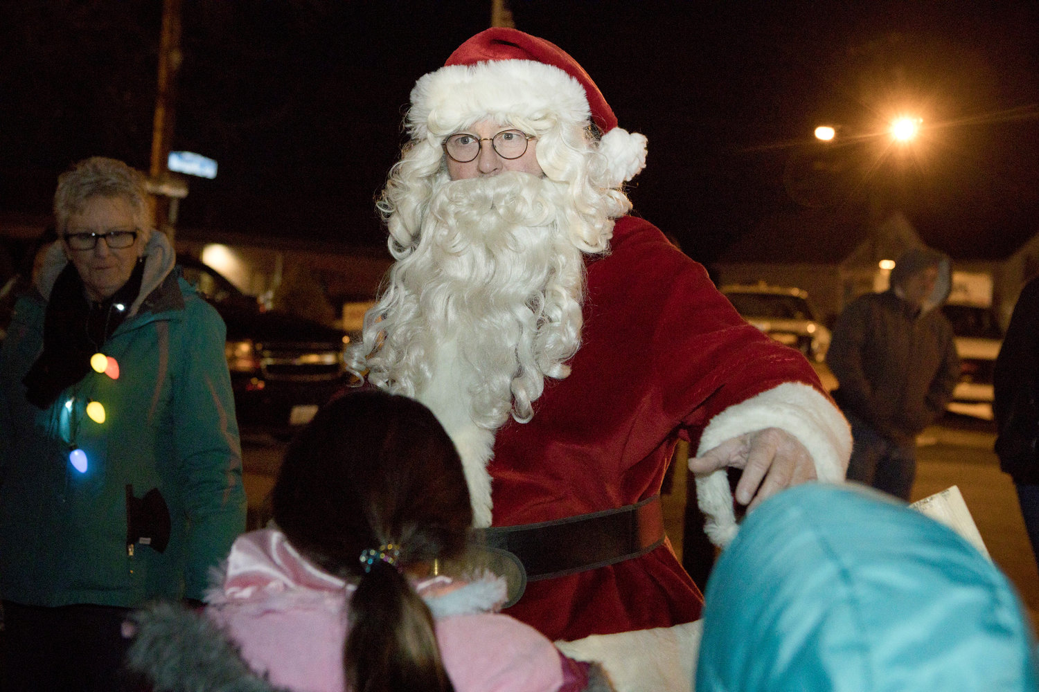 Santa greets children after arriving for the Riverside Renaissance Movement Tree Lighting, Friday, Dec. 3.