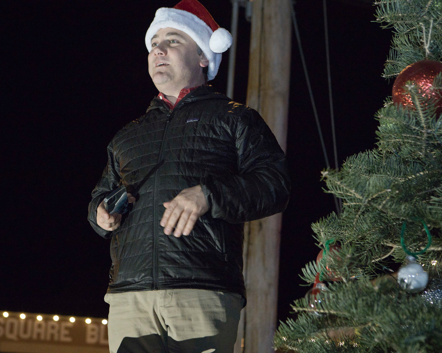 RRM board member Jason Rafferty counts down with the crowd before lighting the Riverside Square tree, Friday night.