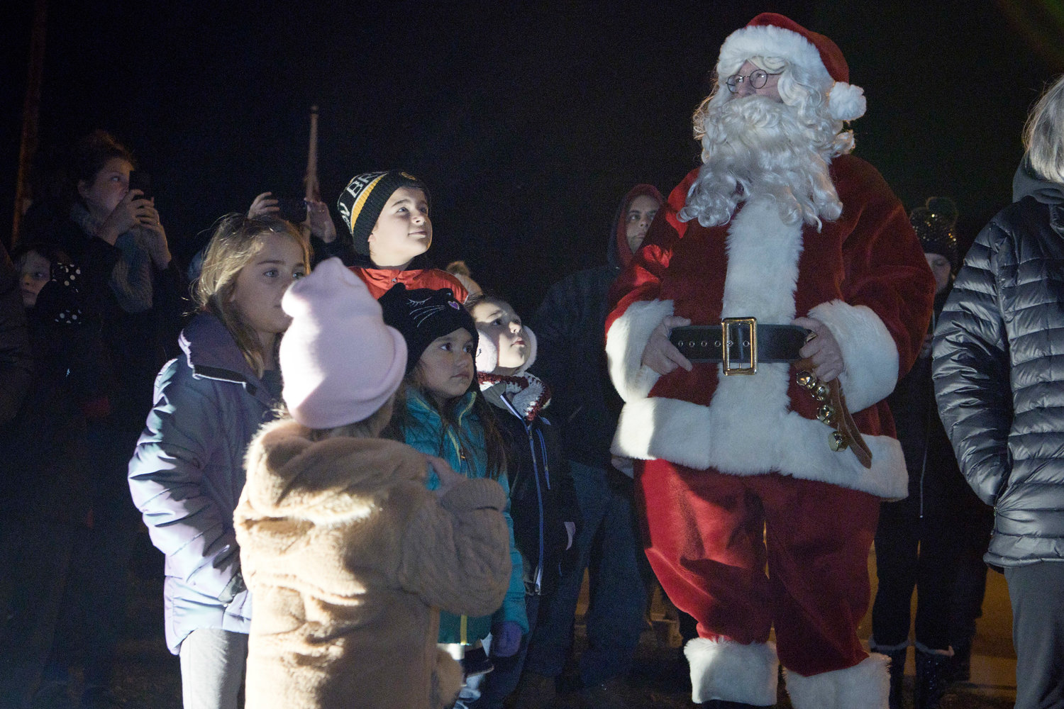 Santa is surrounded by children in anticipation of the Riverside Square Tree being lit.