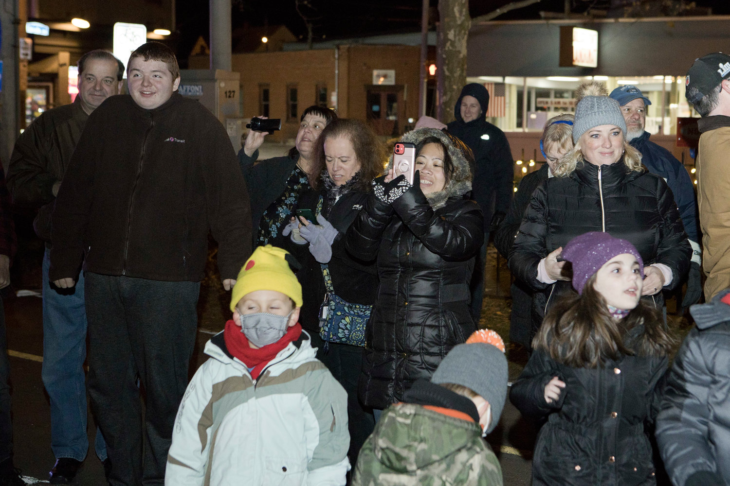 The crowd reacts as the Riverside Square tree is lit, Friday night, Dec. 3.