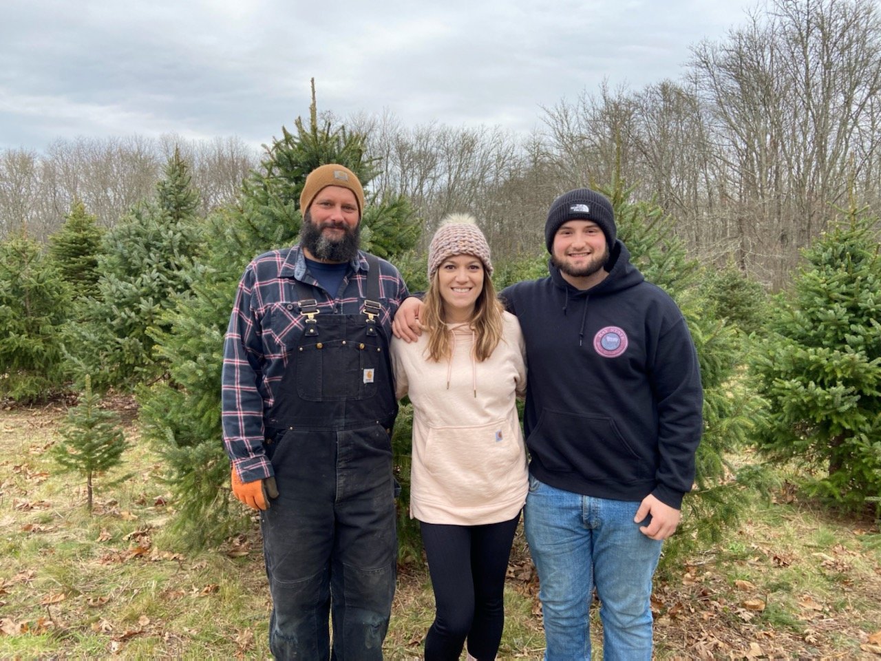 Their first season as tree farmers exceeded all expectations. The Perrys (from left) Lou, Marta and Travis, sold enough in the farm's first five days open to close for the season.