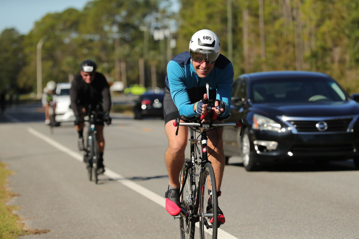 Barrington resident Mark Tracy shares a smile during the bike portion of the Ironman Florida triathlon. He raised more than $11,000 for Camp Braveheart.