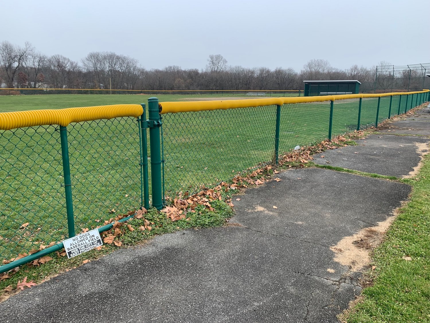 A view of the walking path and Little League field at Kent Heights Playground.