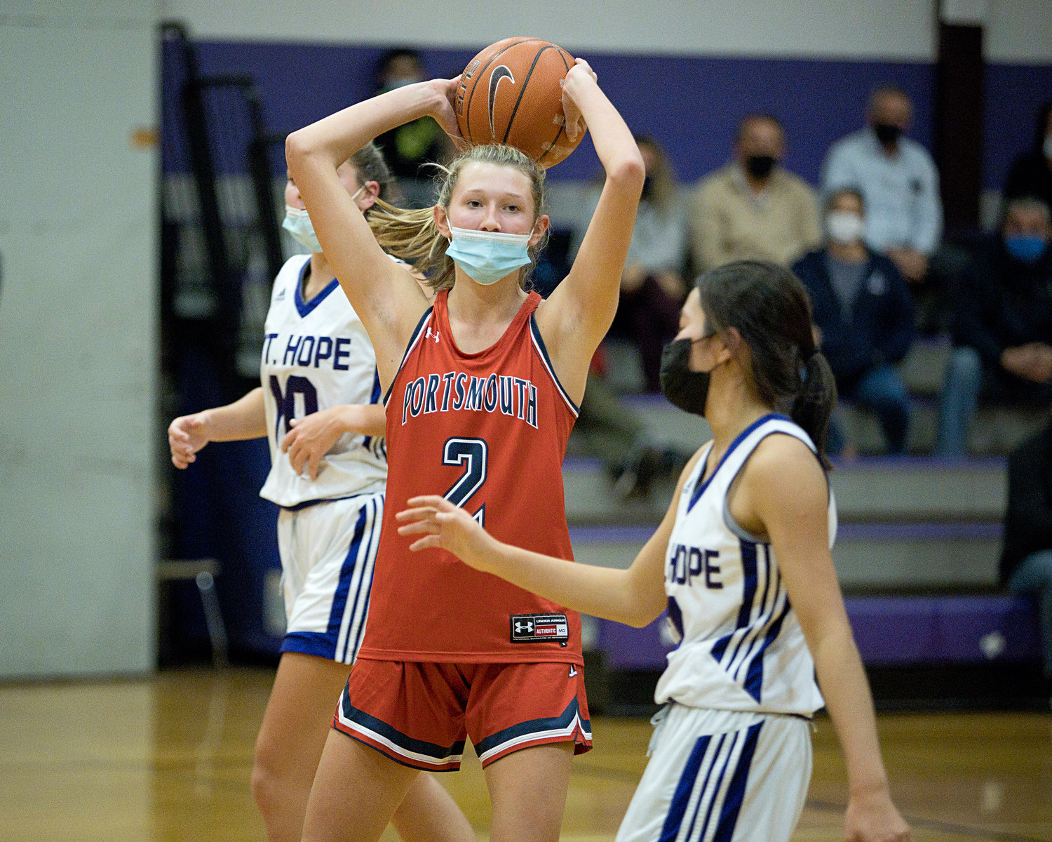 Morgan Casey holds the ball away from a Mt. Hope defender while looking for an opportunity to pass.