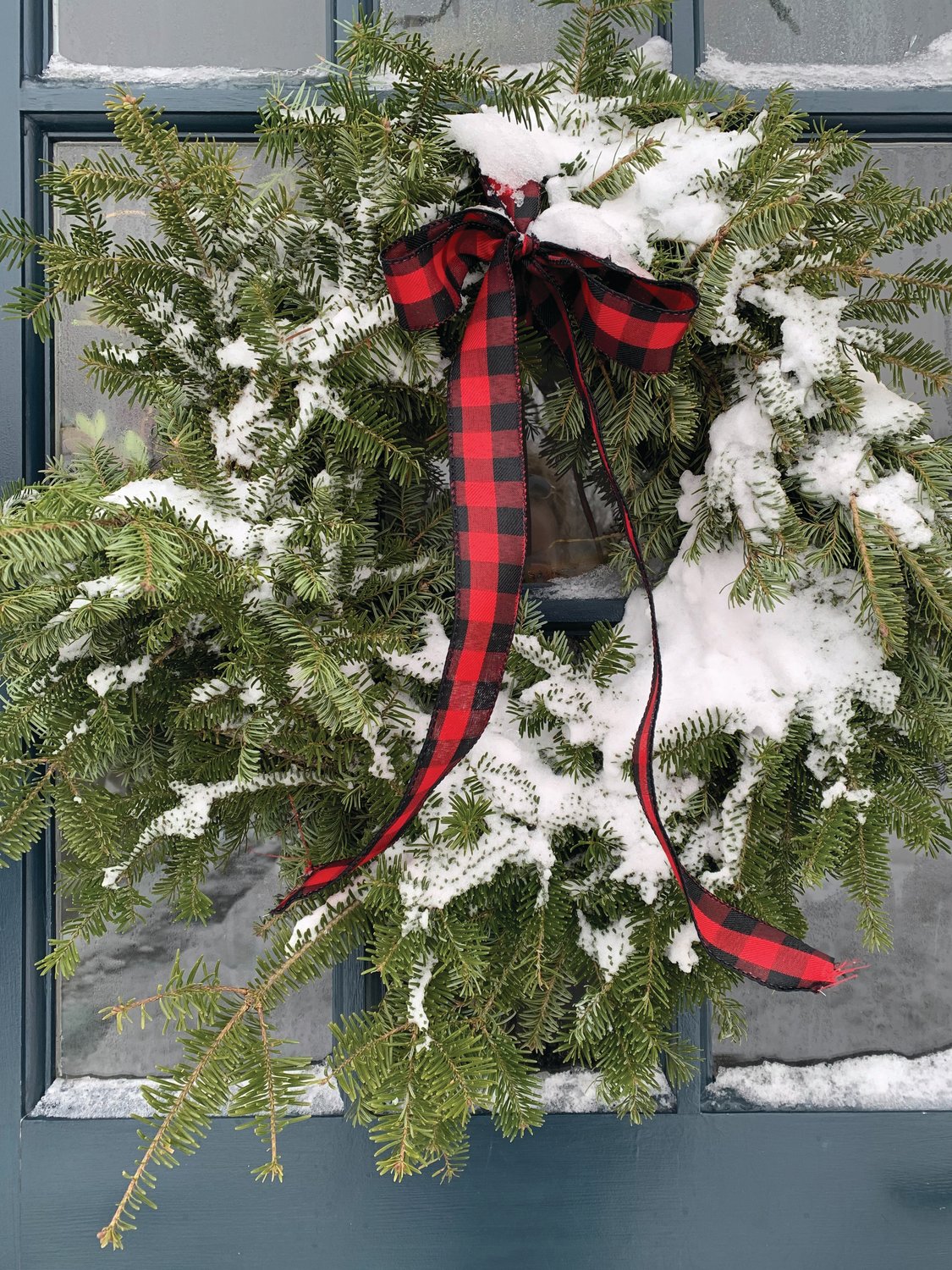 “I like to keep it really simple by adding only a single ribbon, maybe plaid, or whatever I’m in the mood for that year, and tying it on the top.”