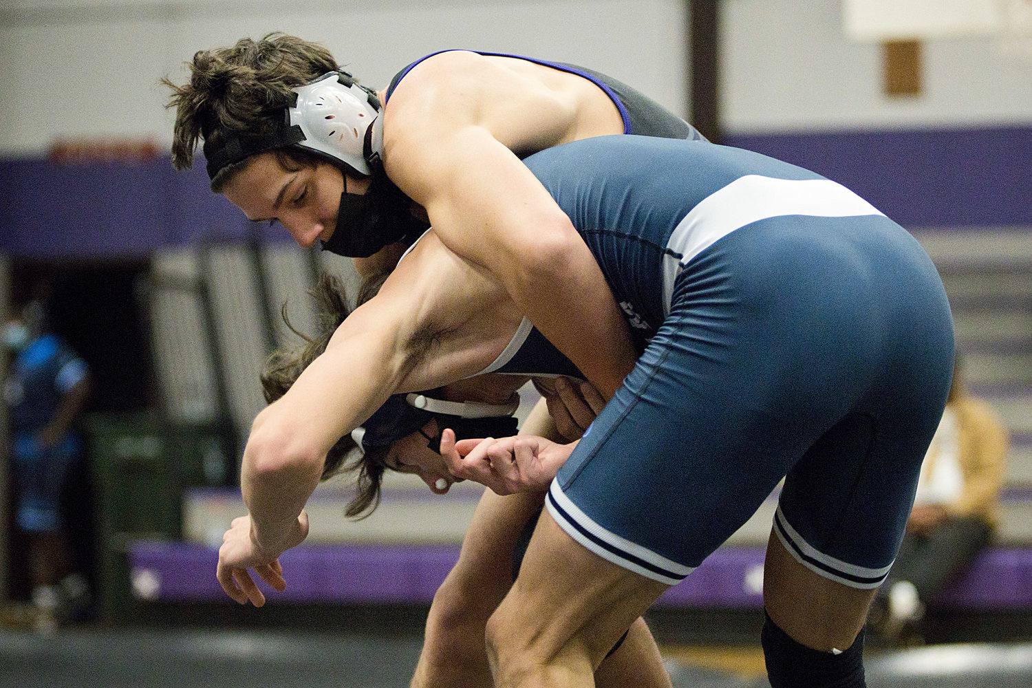 Mason Furtado controls his opponent while competing in the 132
lb. weight class, against Needham, Saturday.