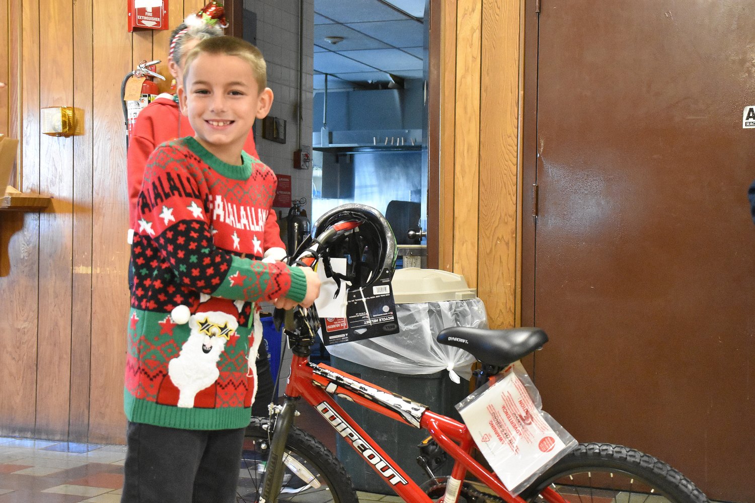 Cole Franco, age 6, and a student at Guiteras School, was one of the lucky winners during the Cup Defenders Association Children's Christmas Party last Sunday.