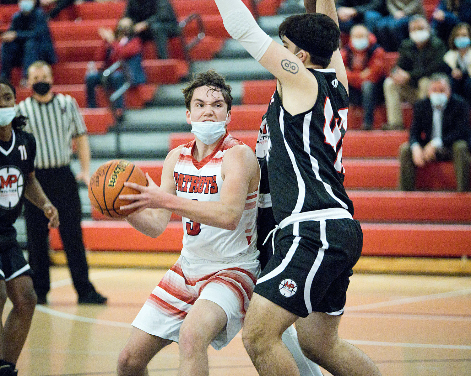 Jack Downing pushes past a Mt. Pleasant opponent during Friday's game.