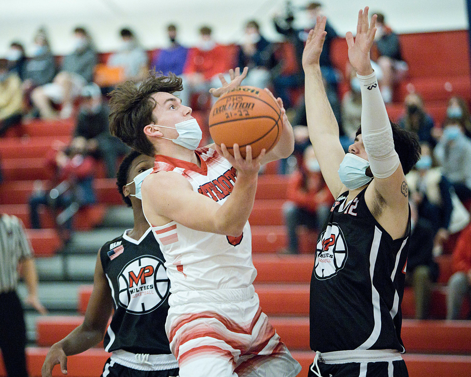 Jack Downing goes up for a basket during Friday's game against Mt. 
Pleasant.