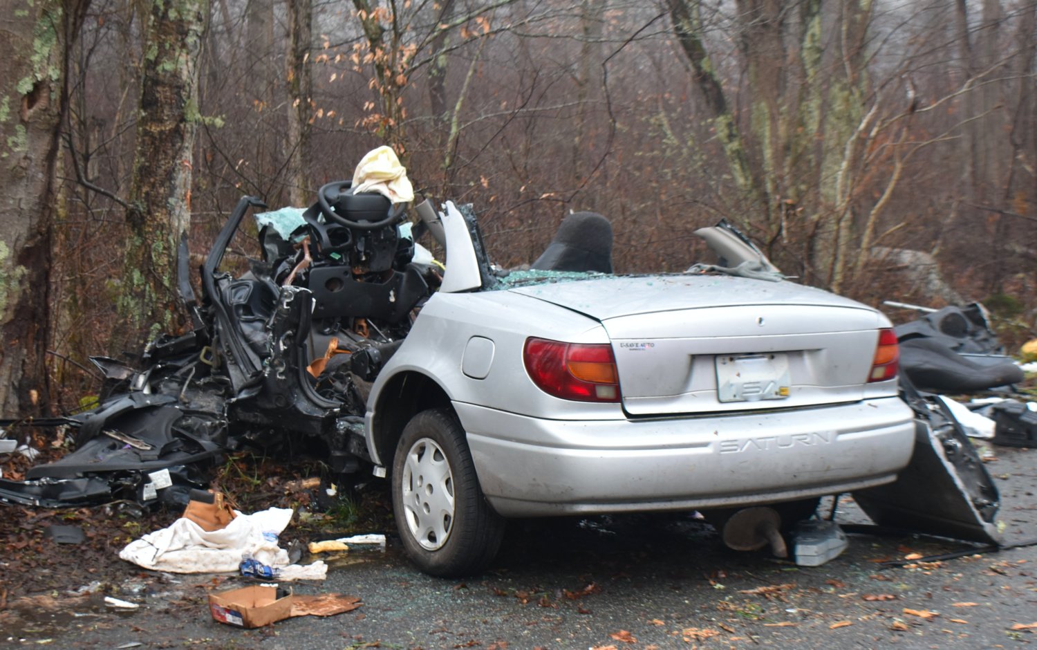 Fire and rescue crews had to cut into John Barretto's Saturn to free him following Friday morning's accident.