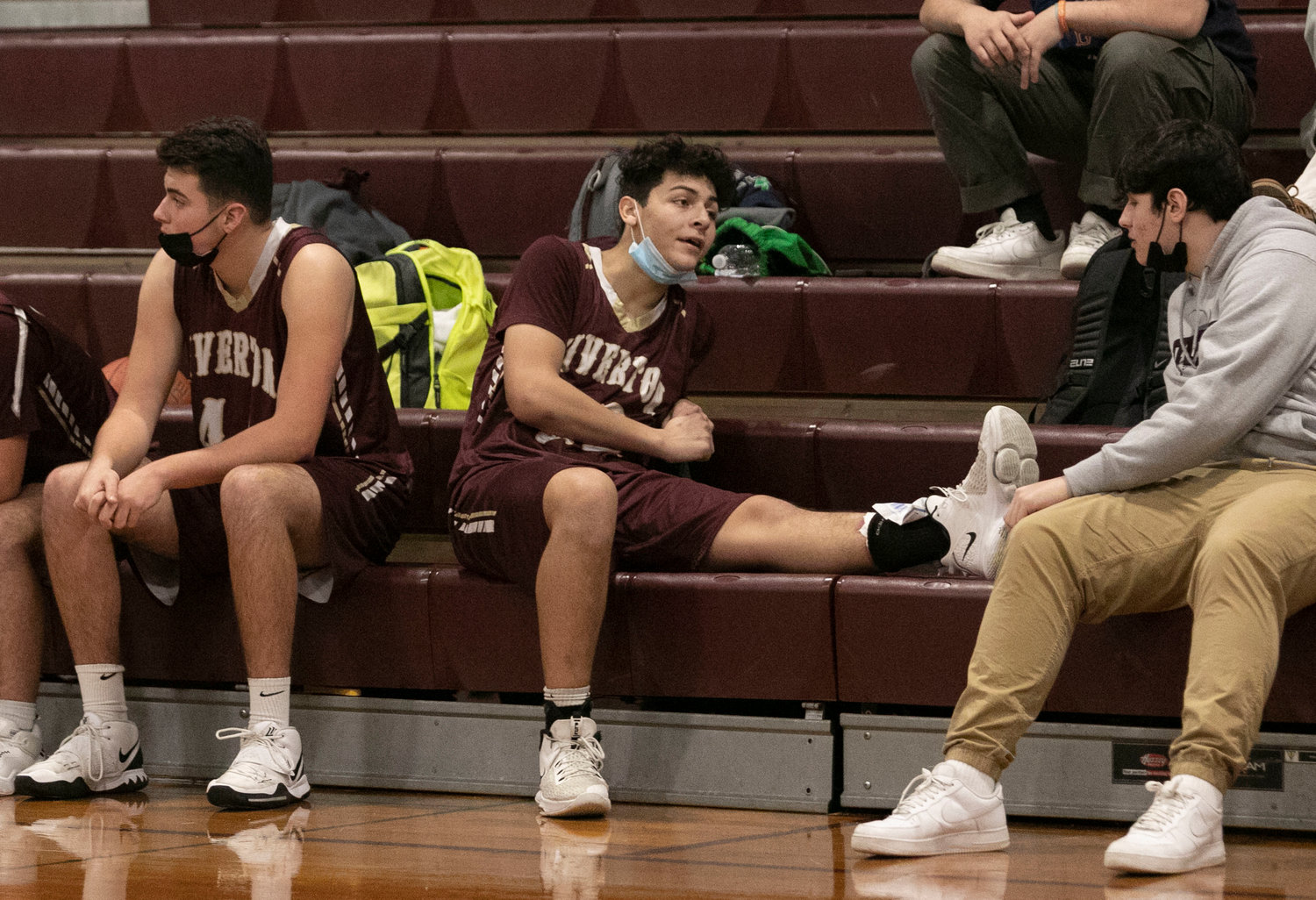Nate Sama relaxes after spraining his ankle in the first quarter. 
Tigers Tristan White (left), Keegan Dutelle and Luke Deldeo thwart Widlcats forward Jayden Zuber as he attempts a layup in the first half. 