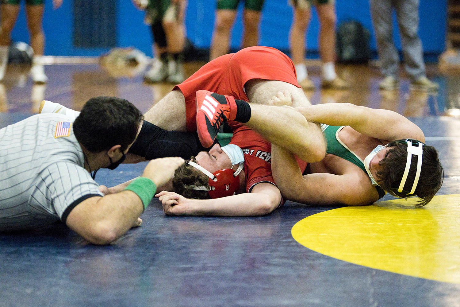 Isacc Peterson attempts to free himself from a Hendricken opponent while wrestling in the 160lb, weight class.