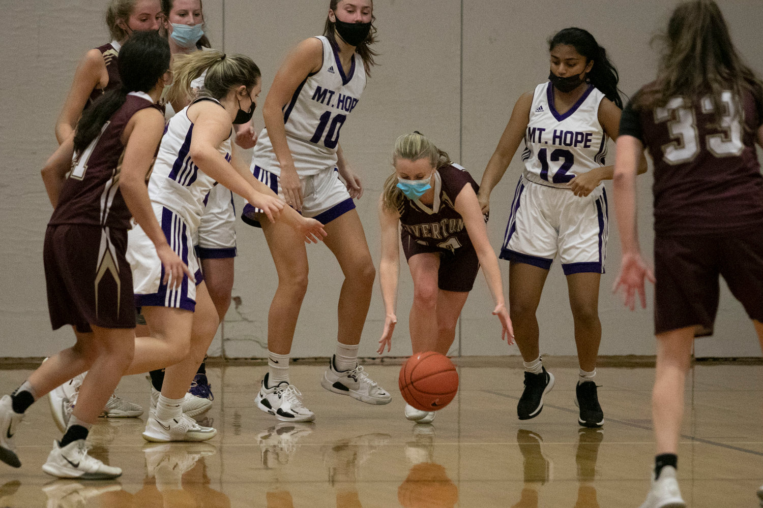 Lily Keating picks up a loose under the Tigers basket.